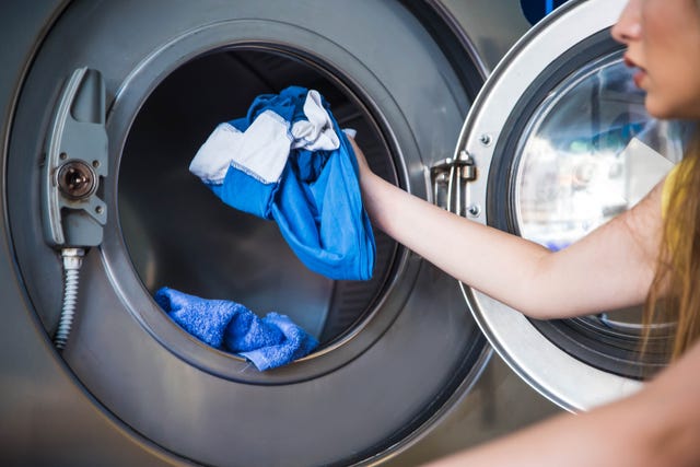 young woman doing laundry