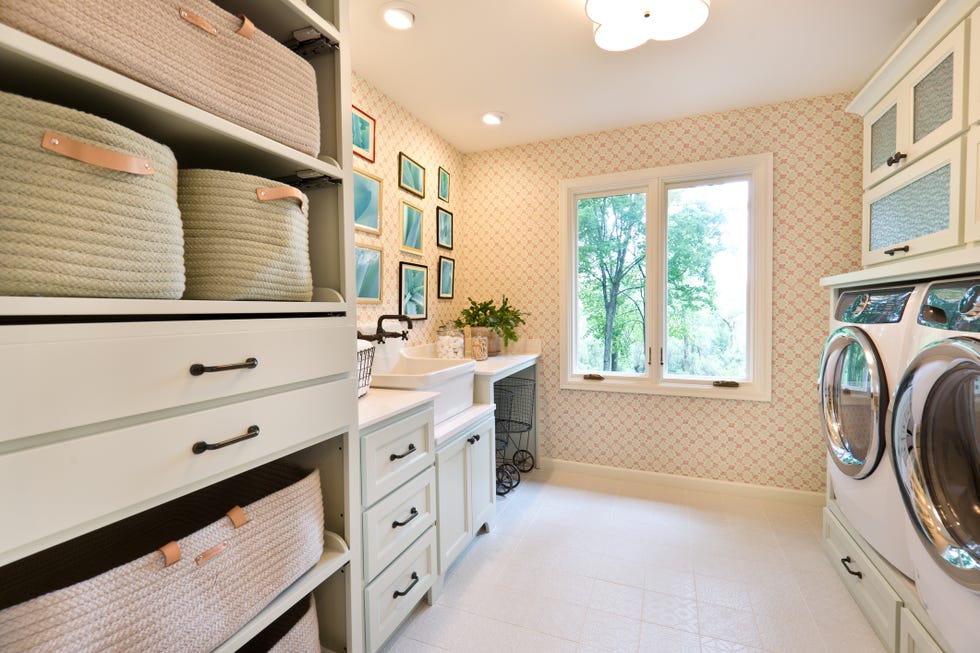 note to inspector framed photo on the wall are taken by me, and it is currently in istock collection showcase interior design of a utility laundry room in a residential home in united states with utility sink and fixture, washer and dryer, storage area