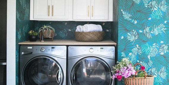 laundry room with botanical wallpaper
