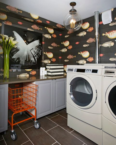 laundry room with fish print wallpaper