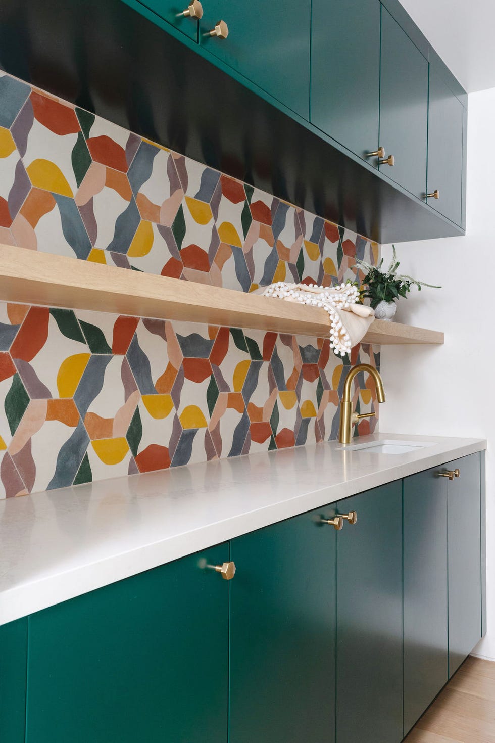 laundry room with colorful tiles