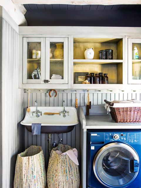 small laundry room with colorful baskets