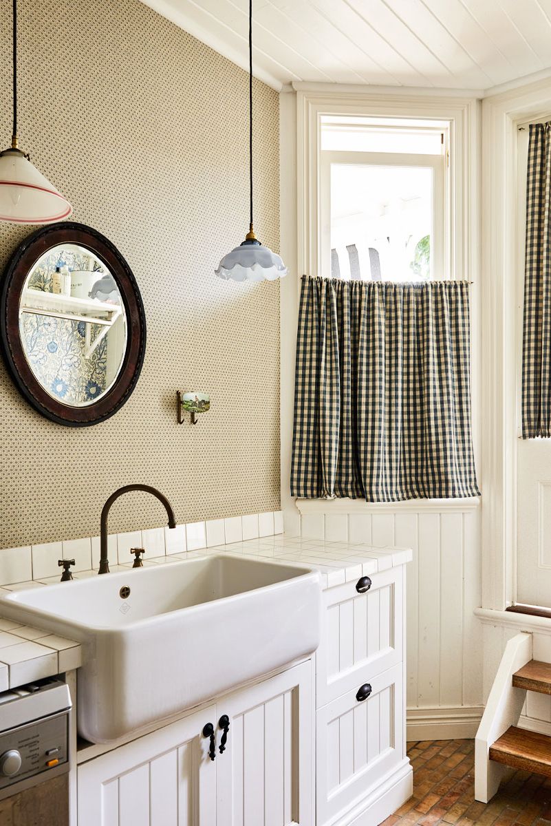 laundry room with gingham cafe curtains