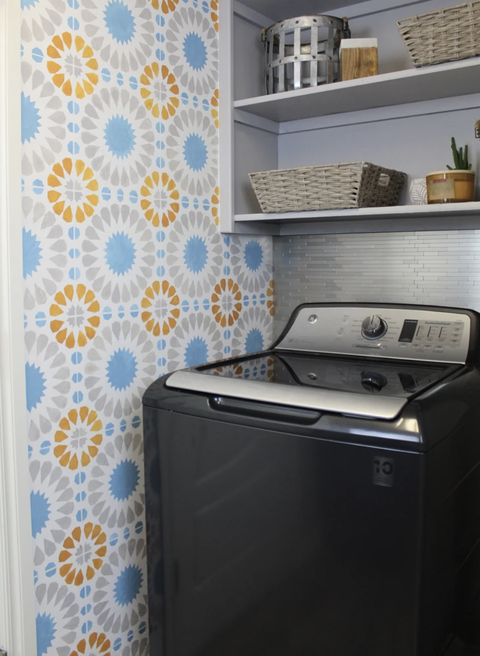 laundry room stenciled wall and silver tile