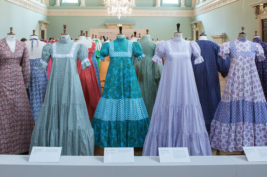 Image of vintage Laura Ashley dresses on display in a museum
