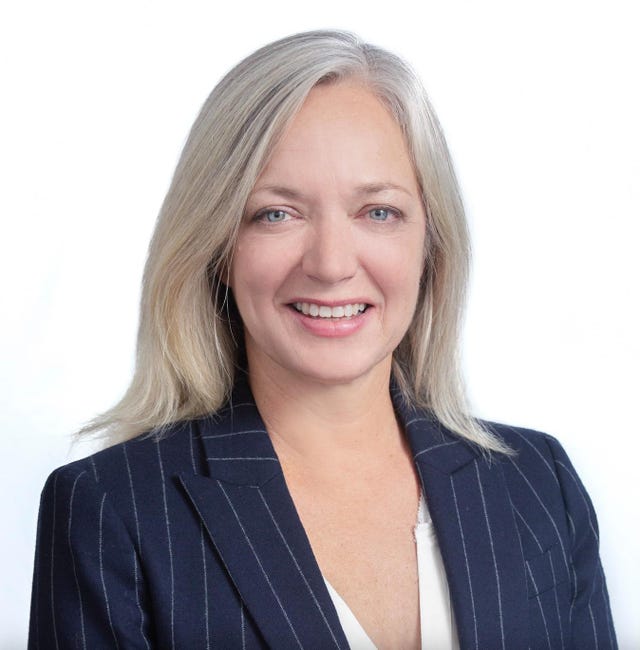 laura brett's headshot on a white background