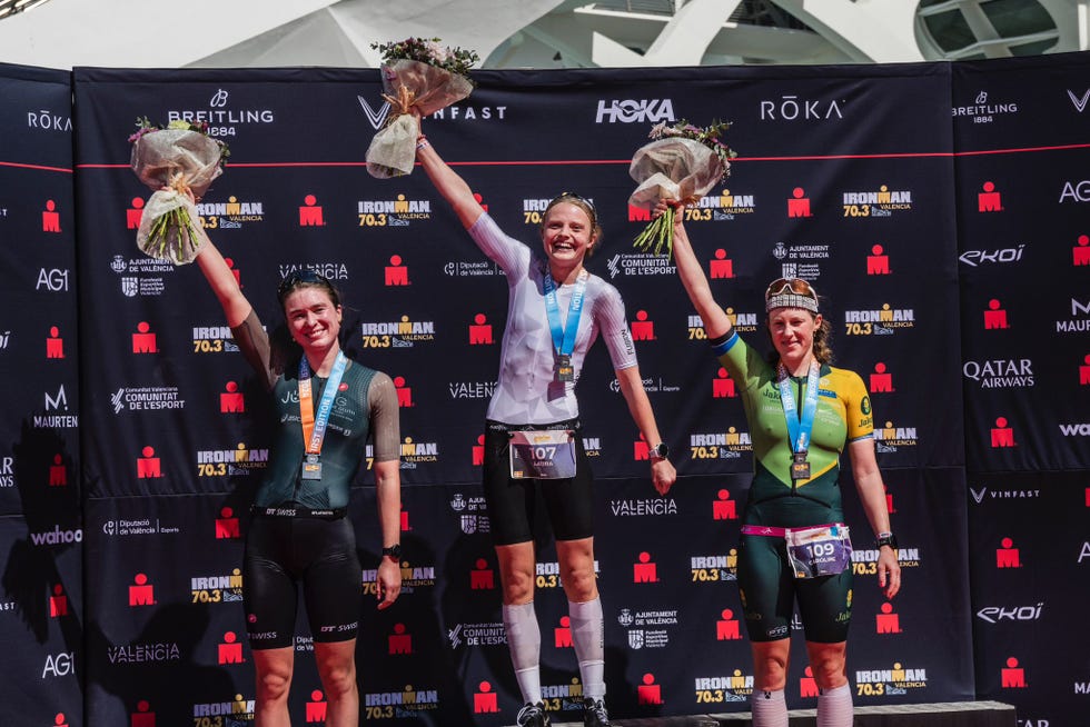 a group of people holding trophies