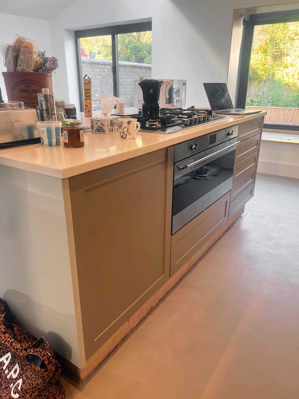 kitchen island with integrated oven and hob