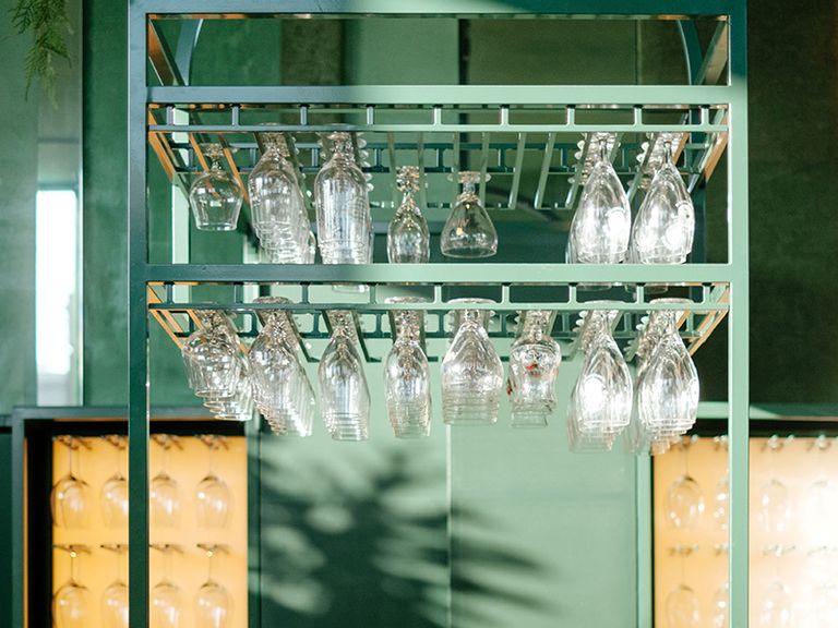 Green, Glass, Lighting, Turquoise, Ceiling, Transparent material, Stemware, Light fixture, Room, Glass bottle, 