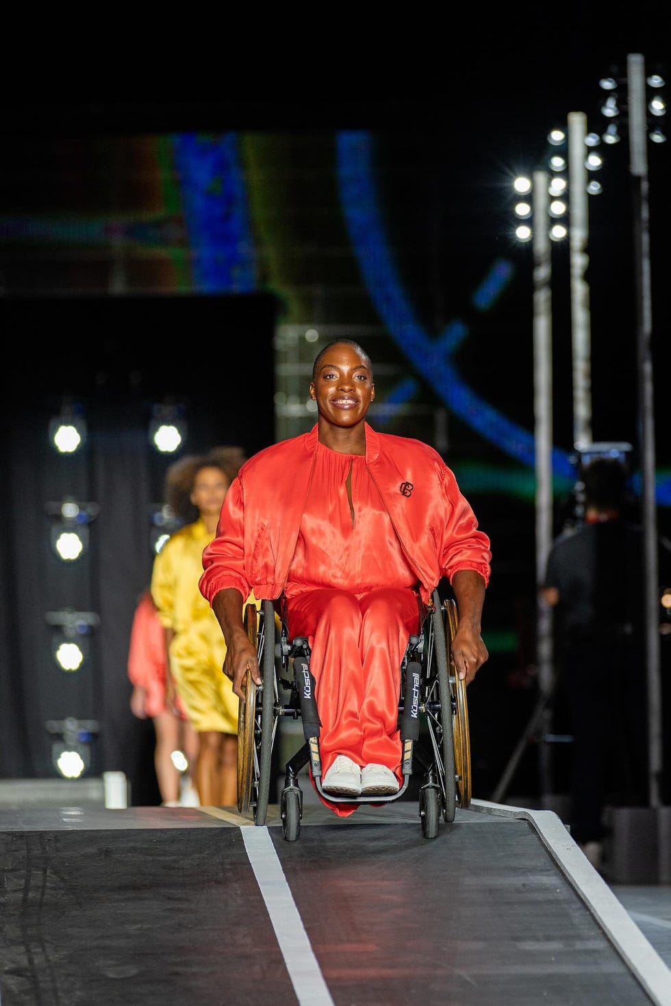 a person in a garment riding a wheelchair