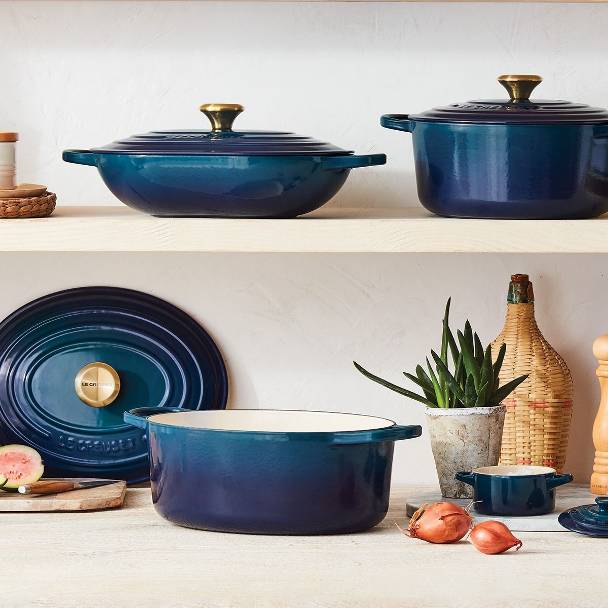 le creuset cookware in agave, a rich green blue color