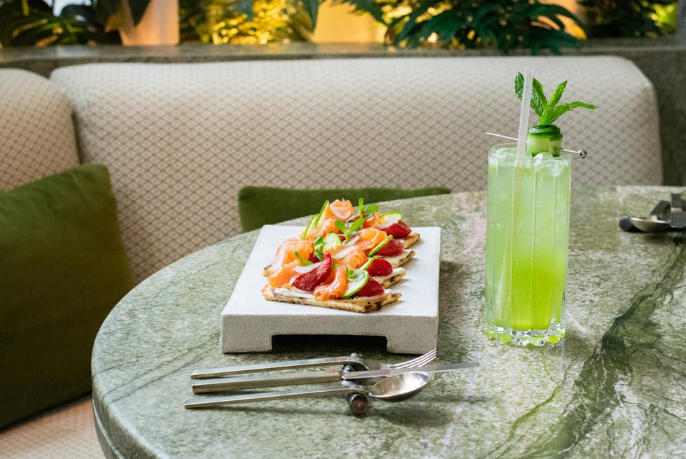 a plate of food and a drink on a table