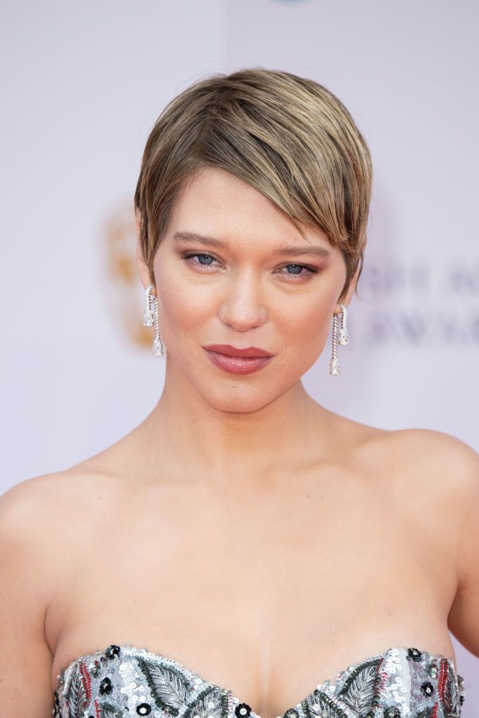 Lea Seydoux Light Red Pixie Haircut with Side Swept Bangs and