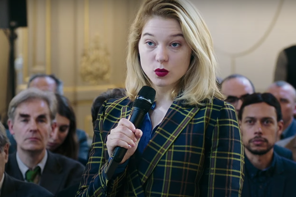 léa seydoux in france holding a microphone at a press conference