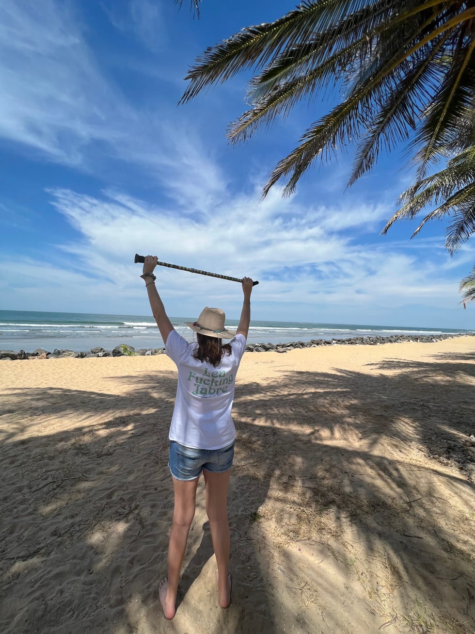 lea jabre on the beach wearing a lea fucking jabre t shirt