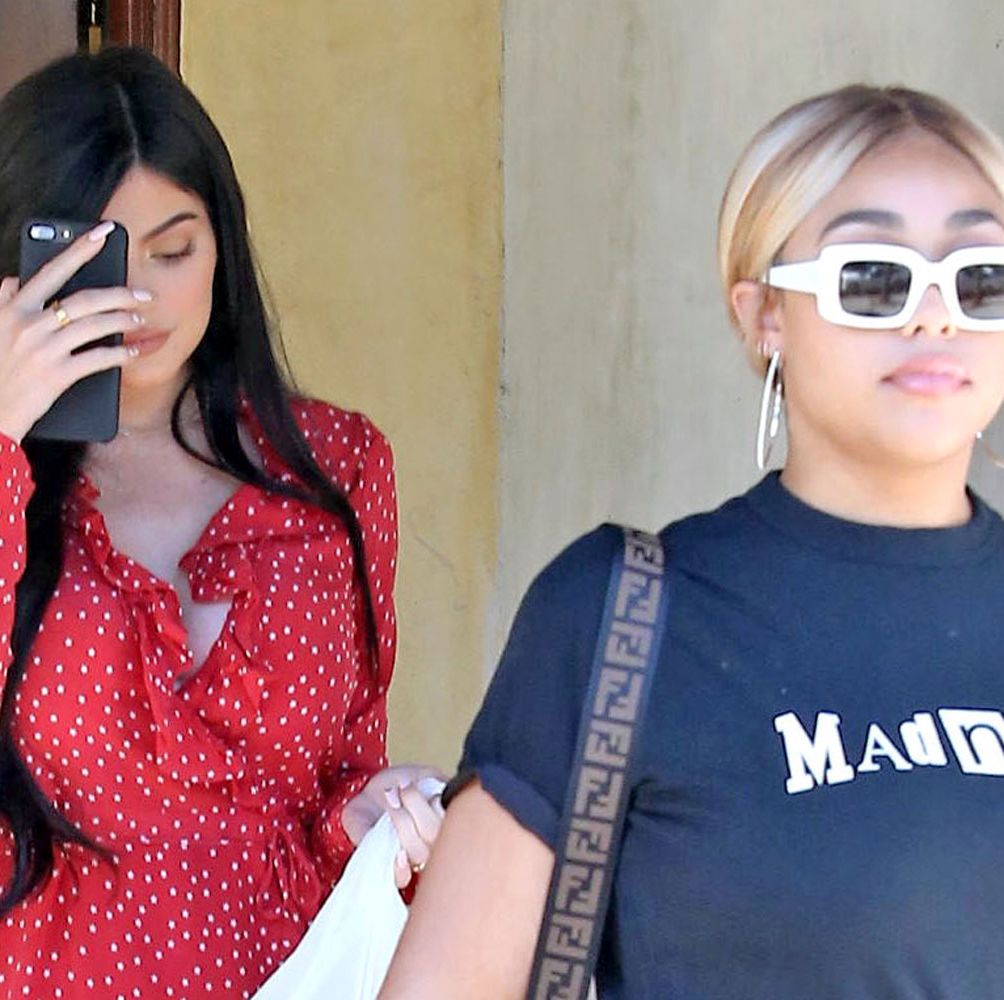 Kylie Jenner flashes her spanx in a flimsy red dress