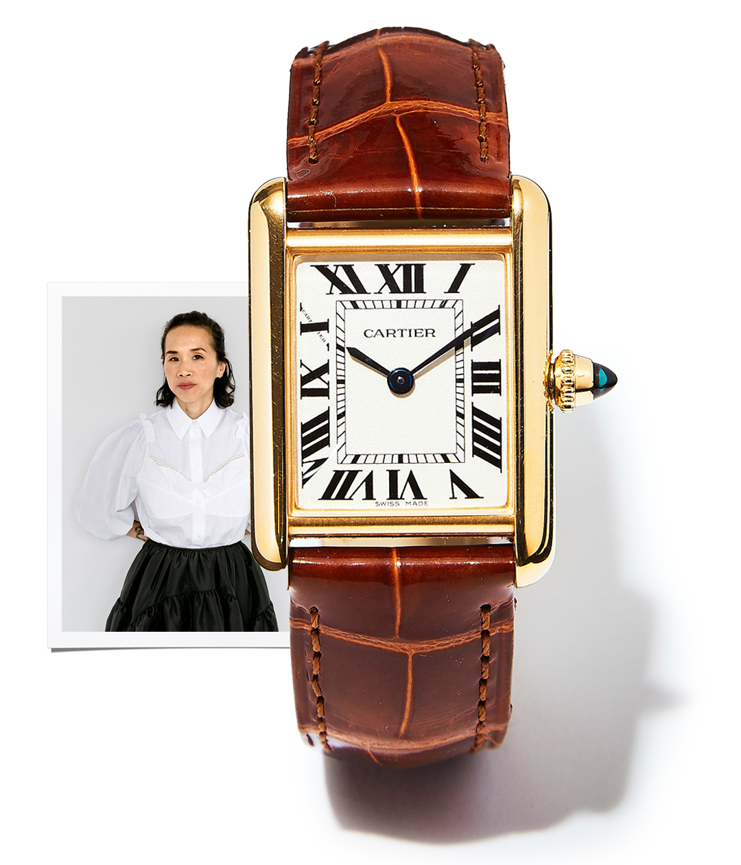 brown watch and picture of woman against white wall wearing white shirt and black skirt