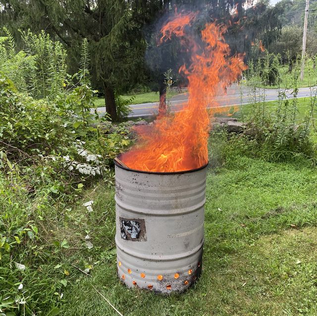 flames coming out of a burn barrel