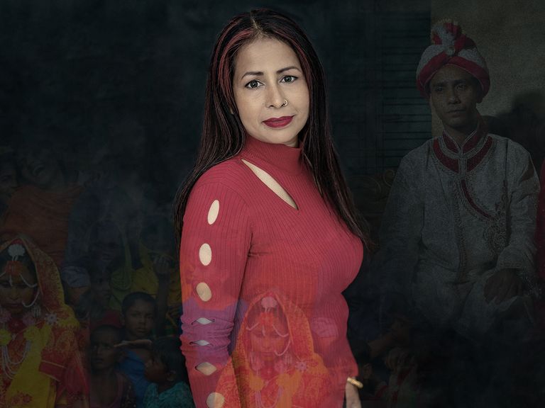 aklima bibi a woman who helps rescue women and girls from forced marriages poses in a red top and she has red streaks in her hair