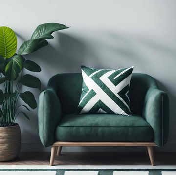a green chair with potted plants