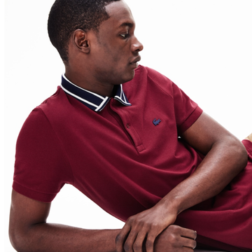 Maroon, Sitting, Arm, Sleeve, Neck, Polo shirt, Outerwear, T-shirt, Collar, Elbow, 