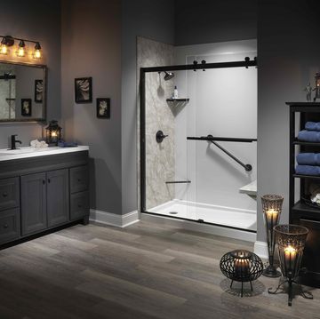 a bathroom with a mirror and a shelf with a mirror