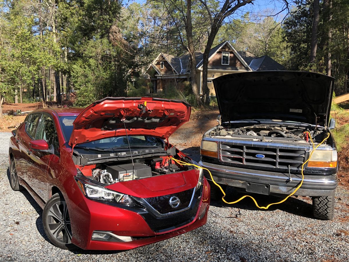 nissan leaf getting a jump start from a ford bronco
