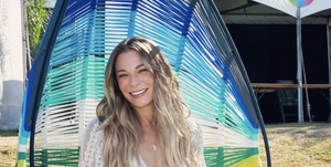 leann rimes at austin city limits posing in a hanging colorful chair