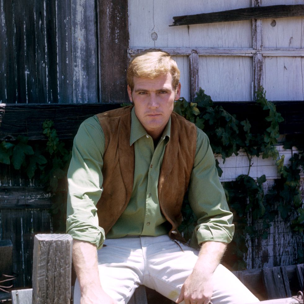 lee majors, us actor, wearing a tan leather waistcoat over a green shirt in a publicity portrait for the us television series, 'the big valley', usa, circa 1967. the western series starred majors as 'heath barkley'. (photo by silver screen collection/getty images)