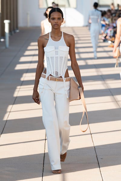 White, Fashion model, Fashion, Clothing, Runway, Fashion show, Shoulder, Waist, Street fashion, Fashion design, 