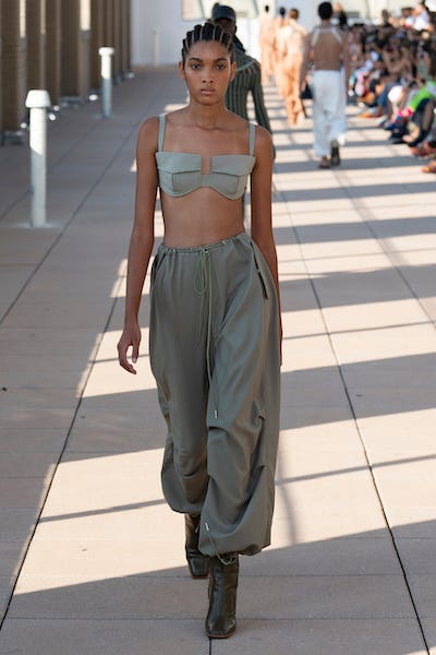 Fashion model, Fashion, Clothing, Runway, Fashion show, Hairstyle, Haute couture, Khaki, Shoulder, Human, 