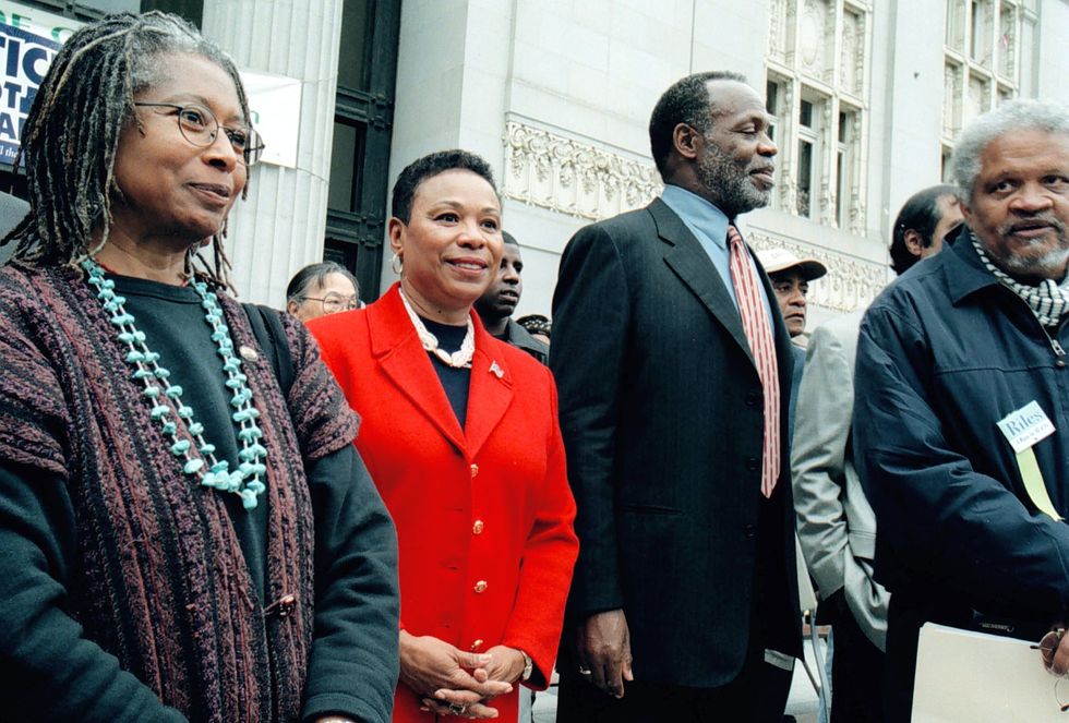 oakland, ca   october 21, 2001 us rep barbara lee, second from left, was flanked by author alice walker, actor danny glover, and author ishmael reed at a thank you, barbara rally at oaklands frank h ogawa plaza sunday afternoon lee made a surprise appearance at the rally held by about 1,500 people in thanks for her ‘no’ vote hers was the only congressional vote in 421 against using armed forces in retaliation for the sept 11 terrorist attacks photo by d ross cameronmedianews groupoakland tribune via getty images