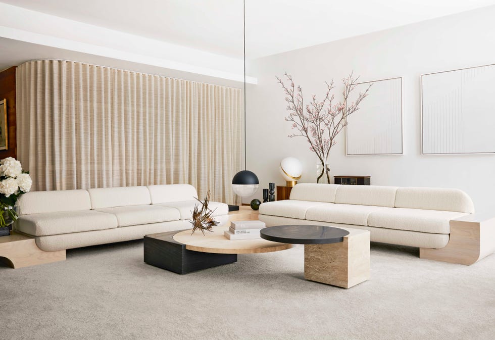 stylish minimalist beige white living room in new york