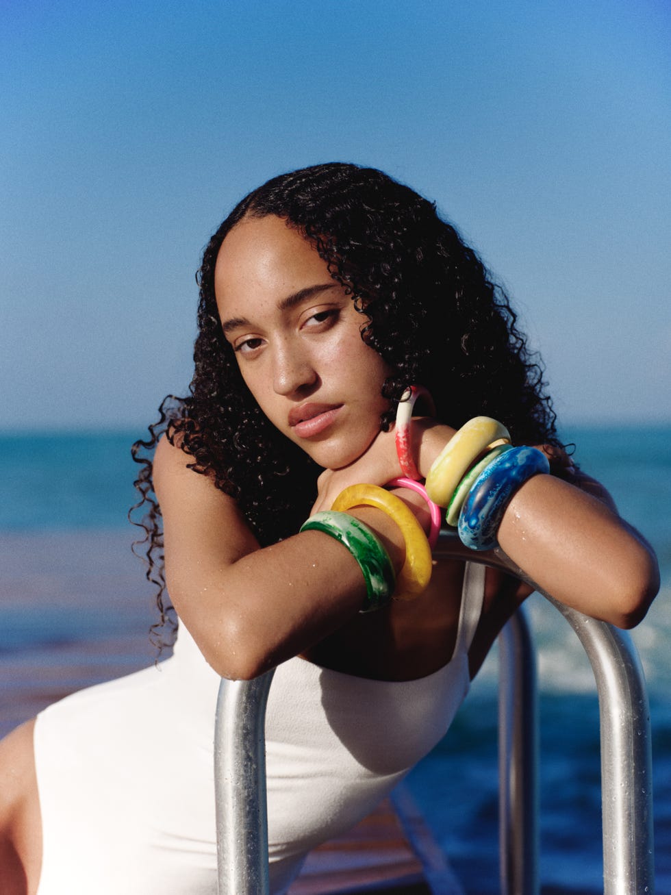 swimsuit, matteau. bangles, dinosaur designs.
