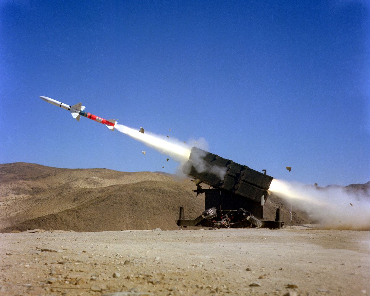 a left side view of an aim 7f sparrow iii air to air missile being launched from a skyguard missile launcher