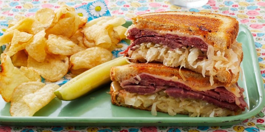 leftover corned beef recipes reuben sandwich with chips and pickle