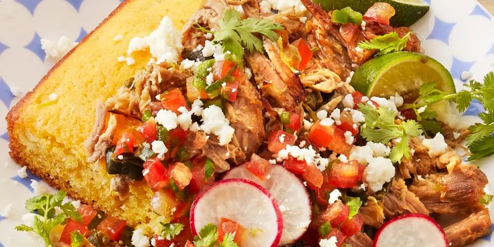 pulled pork over cornbread with radishes and limes