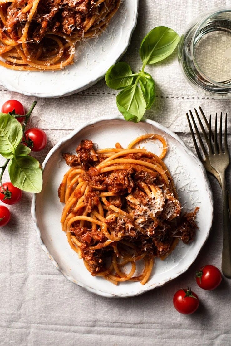 leftover pulled pork ragu with noodles and cherry tomatoes and basil on the side