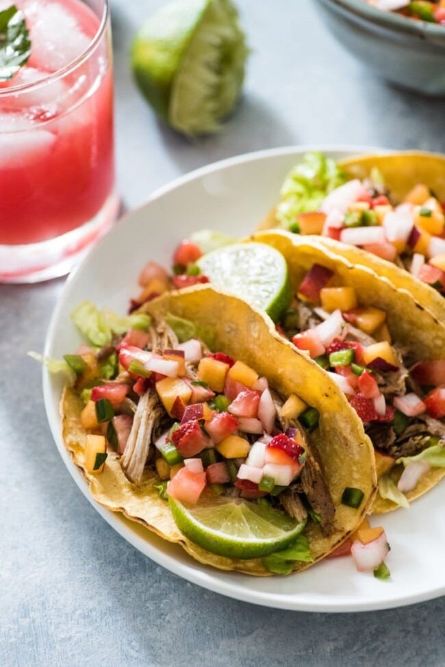 pork rib tacos with peach strawberry salsa and limes