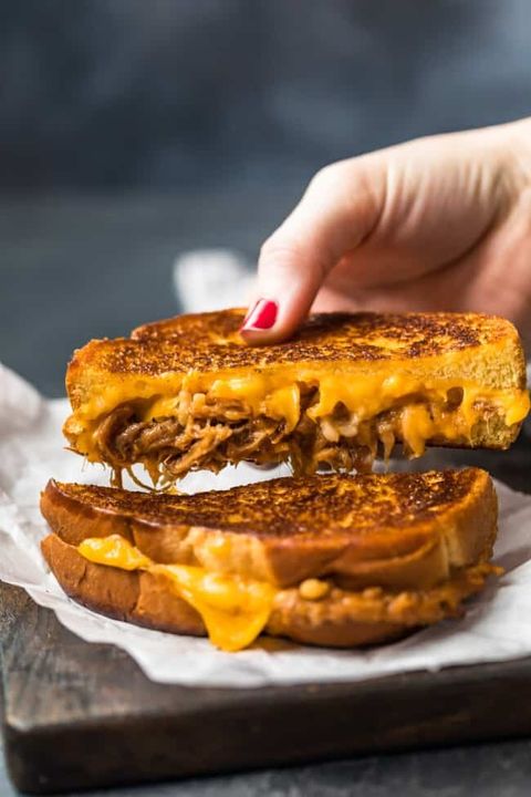pulled pork grilled cheese with hand red nail polish