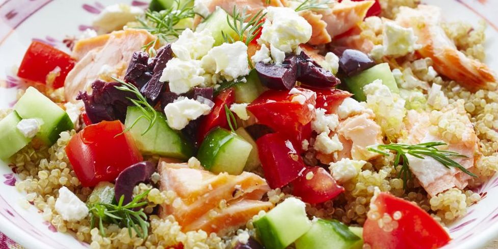 mediterranean salmon quinoa bowl with cucumbers and tomatoes