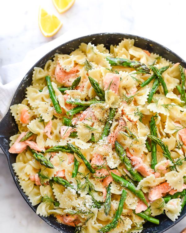 creamy asparagus and salmon pasta in skillet