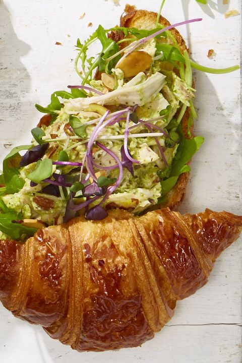 pesto turkey salad sandwich on a croissant