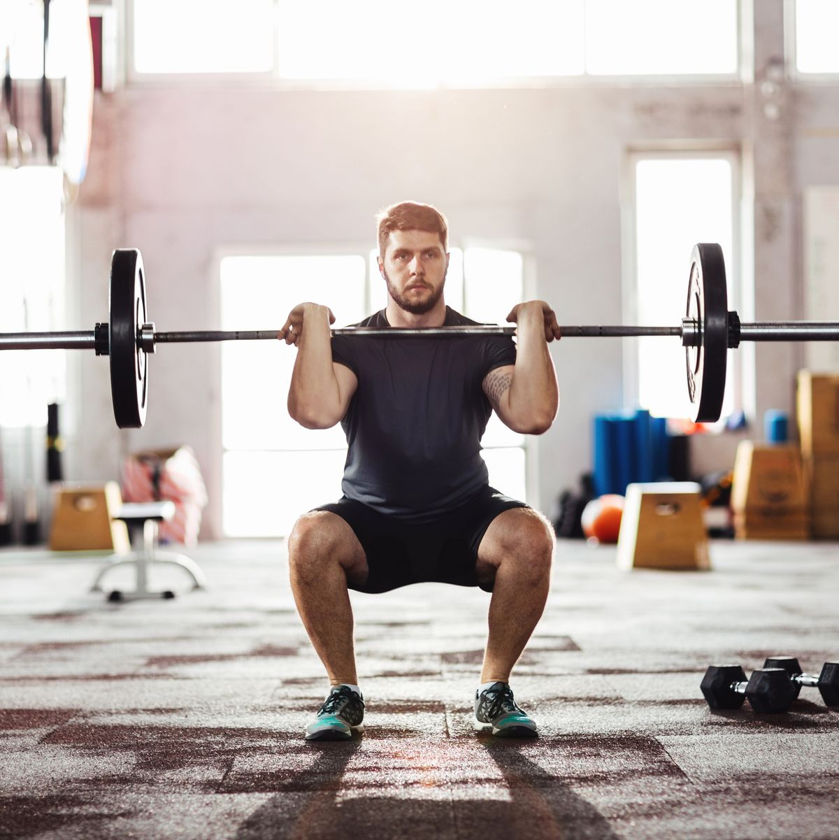 Healthy Fitness Man Working Out Legs With Dumbbells In A Gym - Front Squat  Exercise Stock Photo, Picture and Royalty Free Image. Image 92260585.