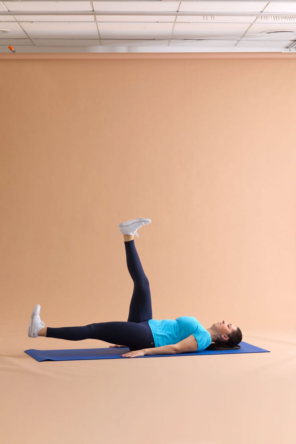 Person performing an exercise on a yoga mat