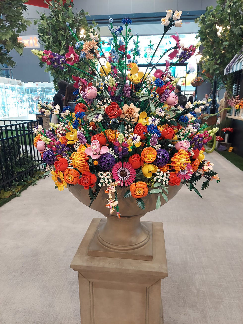 a lego flower arrangement in a huge vase or urn