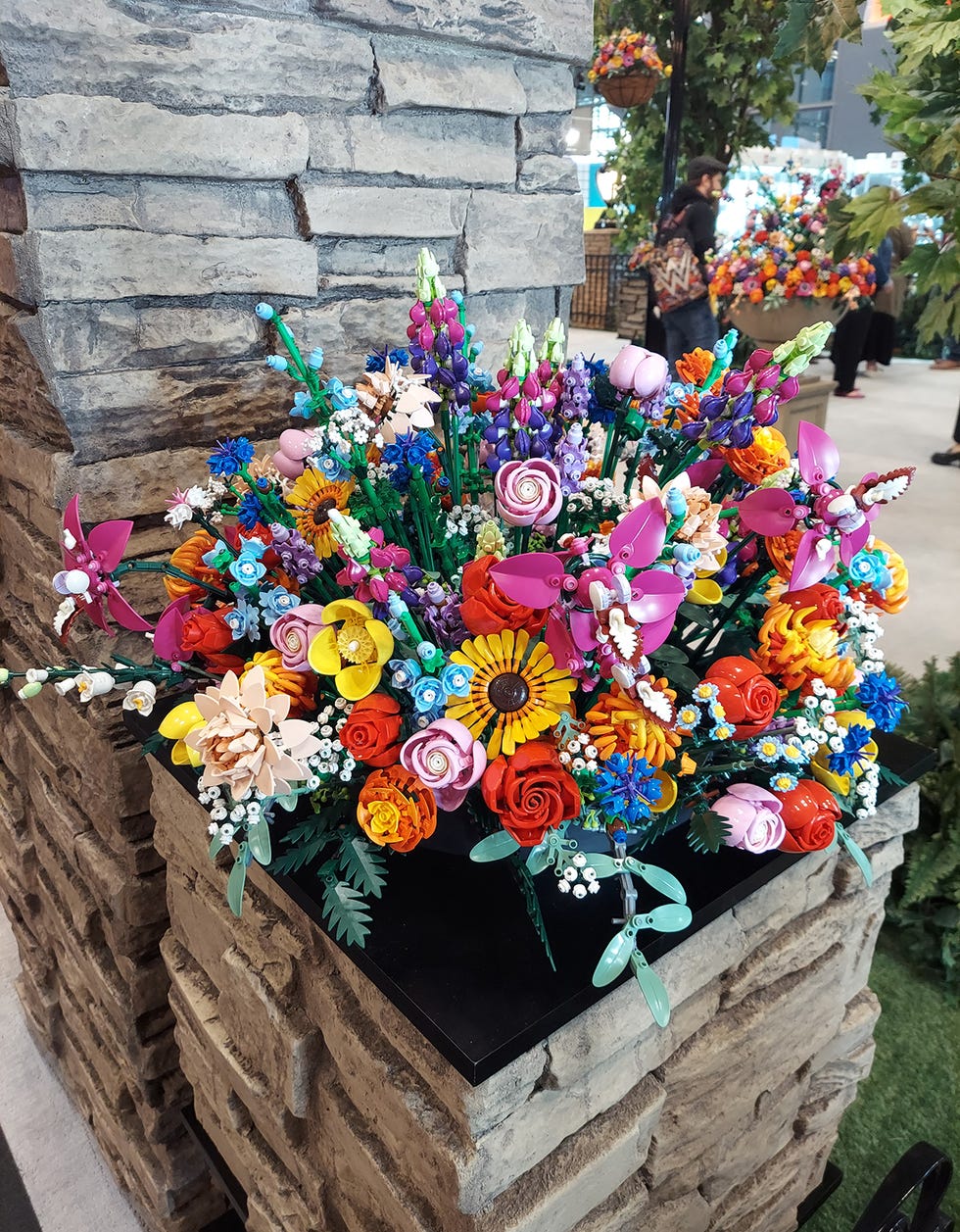 a vibrant arrangement of colorful lego flowers in various shapes and sizes