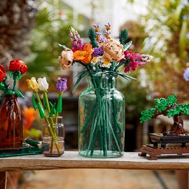 LEGO Botanicals flowers lego botanicals flowers displayed on a bench in a greenhouse full of flowers
