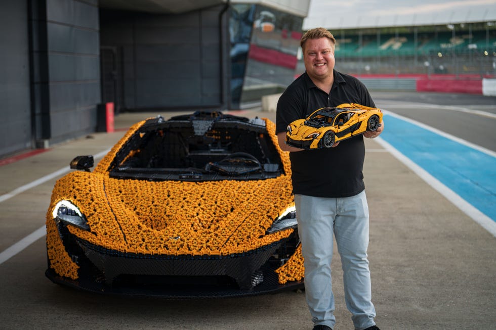 lego group designer kasper rene hansen with the lifesize lego mclaren p1 and the 1 to 8 scale lego model