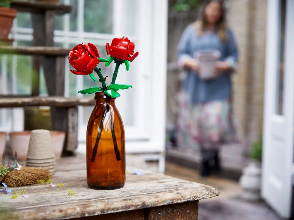 a vase with red roses lego